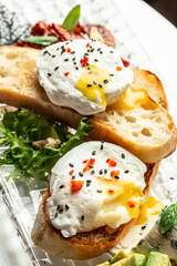 Avocado toast with poached egg, Delicious breakfast or snack, Clean eating, dieting, vegan food concept. top view