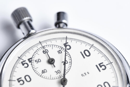 Mechanical stopwatch white background closeup.