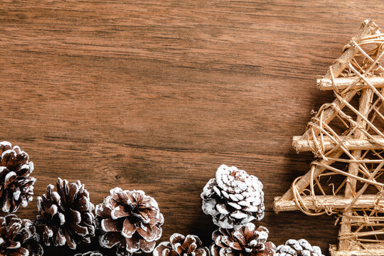 Pine cones on wood background. Christmas decoration with copy space