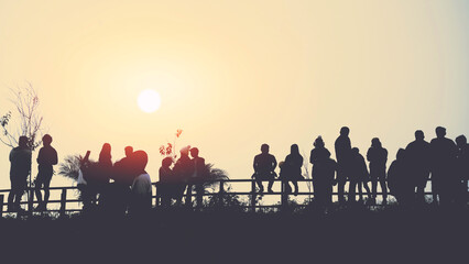asians travel relax in the holiday.People stand looking at the sun in the morning. Stand up for sunrise on the Moutain - obrazy, fototapety, plakaty
