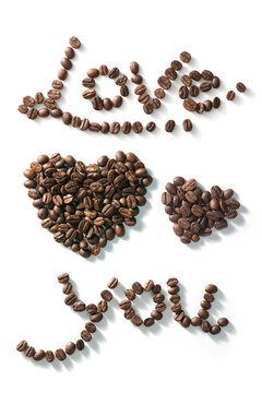 Coffee beans arranged in phrase Love you. Isolated in white