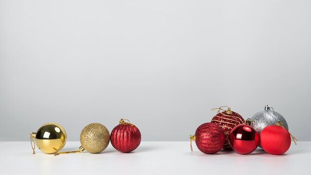 Christmas composition. Christmas balls with red on white background.