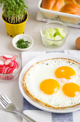 Fried eggs with healthy additions - 745895373
