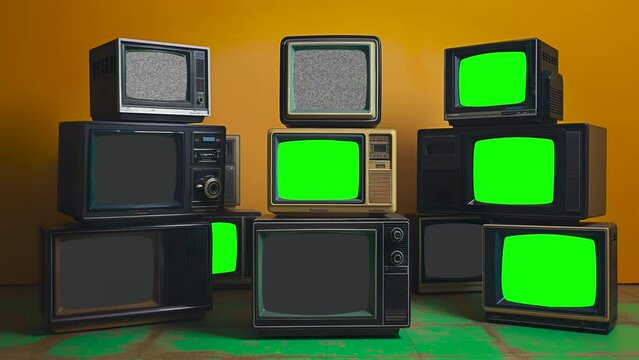 A stack of Retro TVs Powering On with Green Screens, ready for you to overlay your desired footage or images