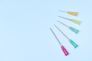 syringe for injectable medication on blue background