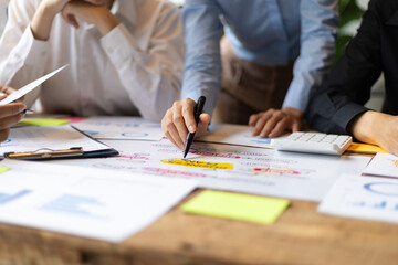 Business people brainstorming discussion on investment strategy analysis and business planning.