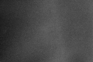 Black paper texture with grain macro closeup