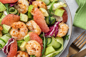 Healthy salad with shrimp prawns, grapefruit, avocado, cucumber and green salad