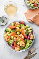 Healthy salad with shrimp prawns, grapefruit, avocado, cucumber and green salad