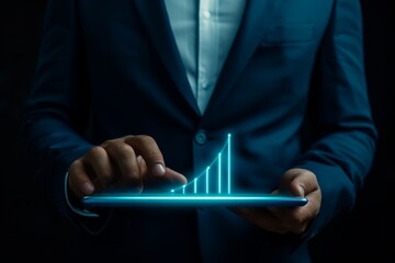 businessman's hand holds a tablet with a 3d graph diagram image over the display