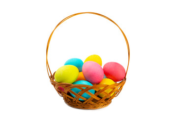 Easter basket filled with colorful eggs isolated on white background. Easter celebration concept. Colorful easter handmade decorated Easter eggs.