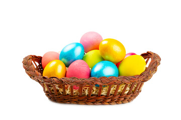 Easter basket filled with colorful eggs isolated on white background. Easter celebration concept. Colorful easter handmade decorated Easter eggs.