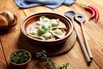 Homemade dumplings on a wooden background. - 745909907
