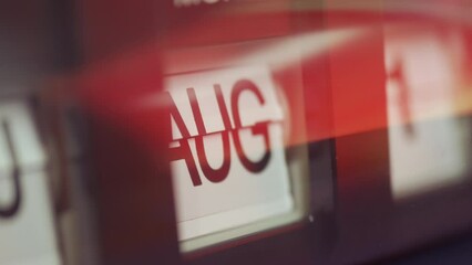 A calendar clock changing the months from January to December