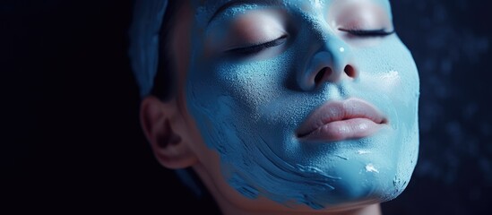 Young Woman Enjoying Alginate Moisturizing Blue Facial Mask For Rejuvenation and Skin Care at a Beauty Spa Clinic