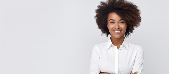 Confident African American Businesswoman Smiling with Arms Crossed in Professional Studio Portrait