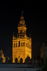 Giralda Bell Tower Of Seville Cathedral At Night In Spain