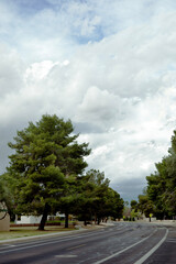 Fototapeta na wymiar Evening dense rain clouds gathering over city streets of Phoenix in Arizona