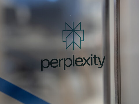 Perplexity AI logo on an office window