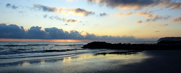 Beautiful sunrise on the sandy beach of the Adriatic coast in summer