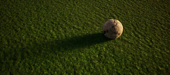 Worn old football on artificial grass. Lit by sunlight. - 745930954