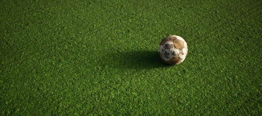 Worn old football on artificial grass. Lit by sunlight. - 745930978