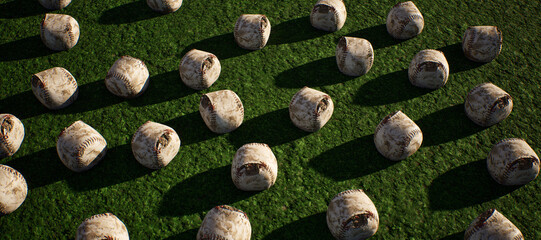Collection of worn old baseballs on artificial grass. Lit by sunlight. - 745931177