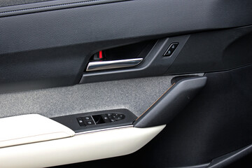 Electric Car door trim with windows control. Car Inside Door Handle Interior. Door trim. Front door...