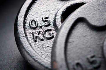 Close-up of two metal gym weights