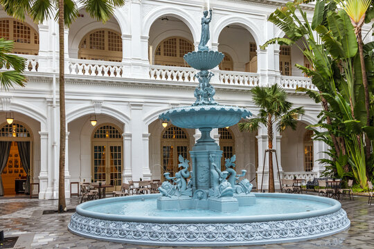 Ornate cast-iron water fountain at the courtyard of Singapore's famous Raffles Hotel