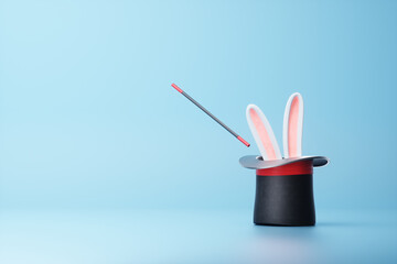 Rabbit ears sticking out of black magician cylinder with wand. Concept illusionist, magic tricks, magic, advertising template, banner. 3D rendering, 3d illustration, Copy space.