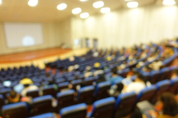 blurred or defocused people in the seminar convention hall. Business meeting for a press conference...