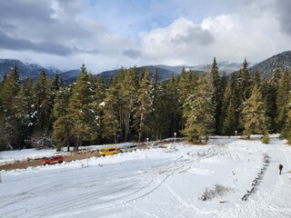 Fototapeta premium Beautiful snowy white mountains view in the famous Bansko ski resort in Bulgaria