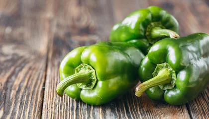 Tuinposter Green peppers, copyspace on a side © Giuseppe Cammino
