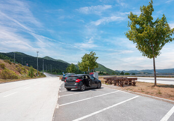 Car parking on the highway. Parking lot for drivers to rest on the highway.
