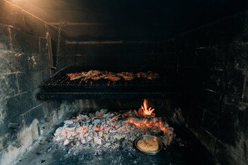 Typical Argentinian barbecue or asado. - obrazy, fototapety, plakaty