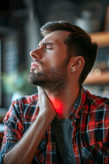 Naklejka premium A man with severe sore throat expressing obvious discomfort and pain. A man with closed eyes denotes the uncomfortable and distressing sensation of a sore throat.