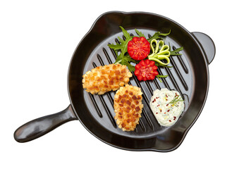Fried minced meat cutlets with vegetables and sauce on black pan on transparent background. Chicken Pozharsky cutlets. View from above