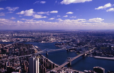 Aerial view of New York City skyline with Three Bridges from World Trade Center in early 1990s