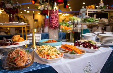 Buffet with a variety of salads, appetizers, and desserts