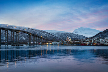 Winter Panorama at sunrise with view of the cityscape of Tromso and the Arctic Cathedral, Norway