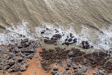 Beautiful landscape from the drone of the French rocky coast by the ocean in Brittany.