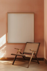 modern peach colored space with an antique wooden chair, smooth walls and a large empty picture frame