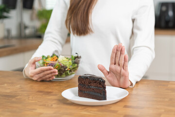 Diet, Dieting asian young woman using hand push out, deny chocolate cake or sweet taste, dessert...