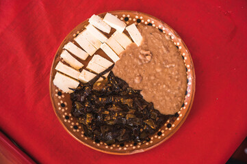 Capon chiles, typical food from the state of Michoacan, Mexico, accompanied by ranch cheese and beans.