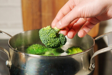 Cooking broccoli, proper, healthy nutrition. Selective focus