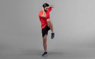 Full body length gaiety shot athletic and sporty young man with fitness warmup and stretching body...