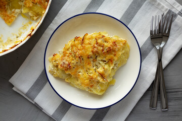 Homemade Hasselback Potato Gratin on a Plate, top view.