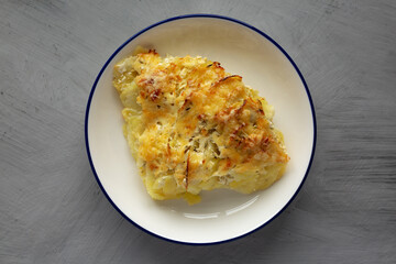 Homemade Hasselback Potato Gratin on a Plate, top view.