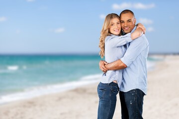 Portrait of beautiful happy couple together on the beach.